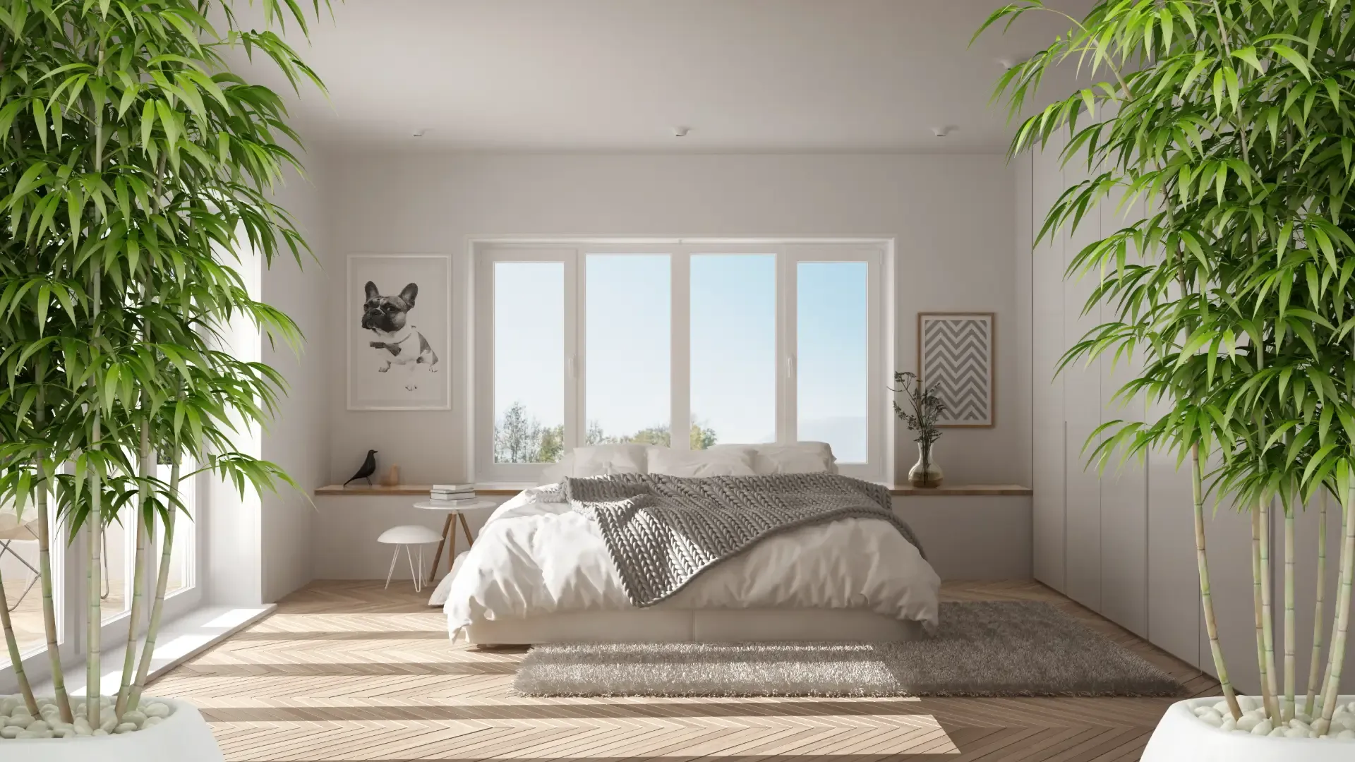 Bright, minimalist bedroom featuring a bed in front of large picture windows, flanked by potted bamboo trees.