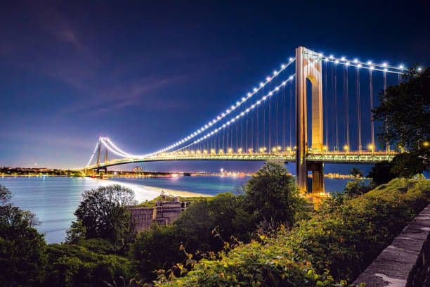 Verrazano-Narrows Bridge illuminated at night spanning between Brooklyn and Staten Island over the East River